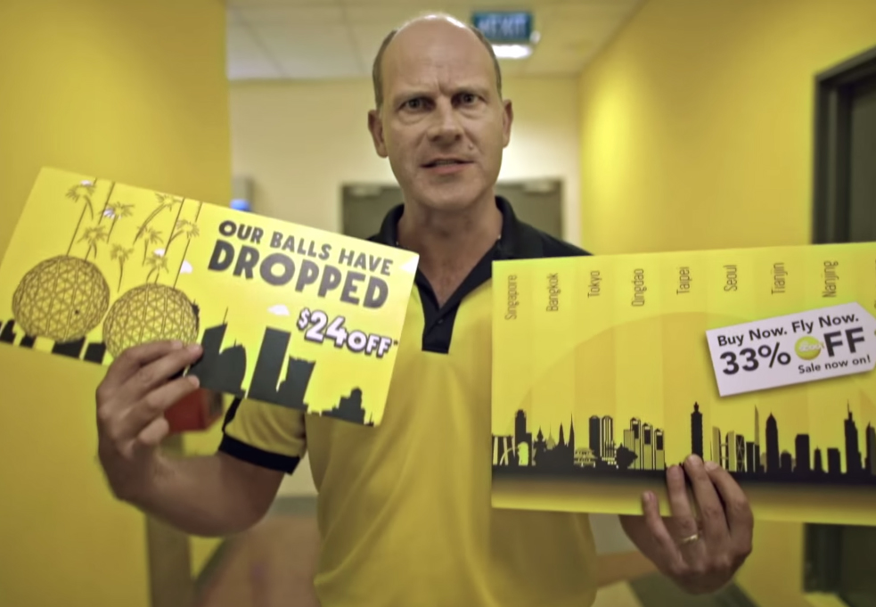 The Scoot Inspiring Spirit campaign image, featuring the airline's yellow branding and campaign materials