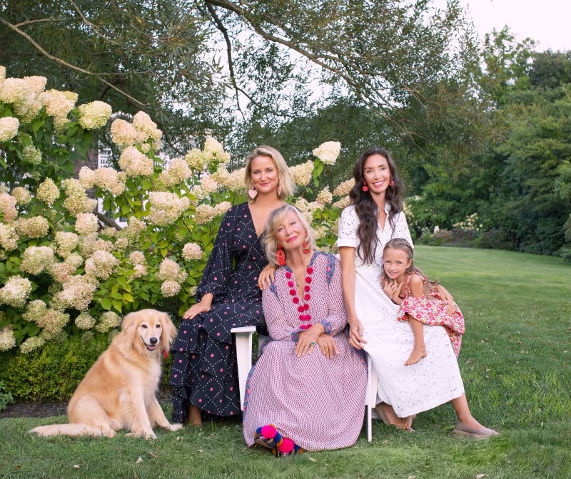 Sylvie Chantecaille with her family and dogs in the garden