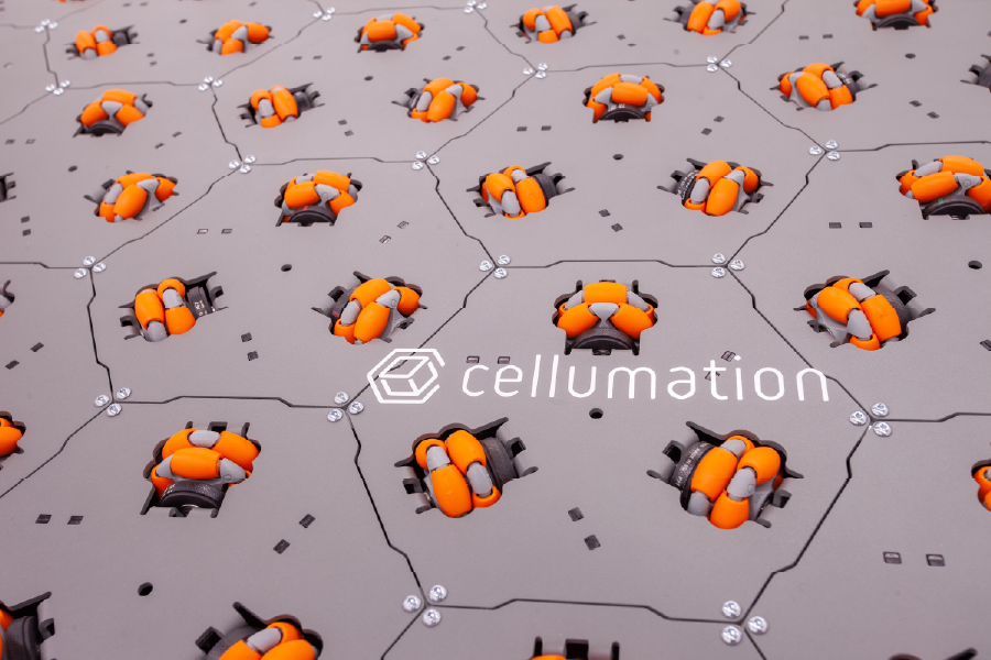 Hexagonal celluveyor conveyor cells with orange omnidirectional wheels