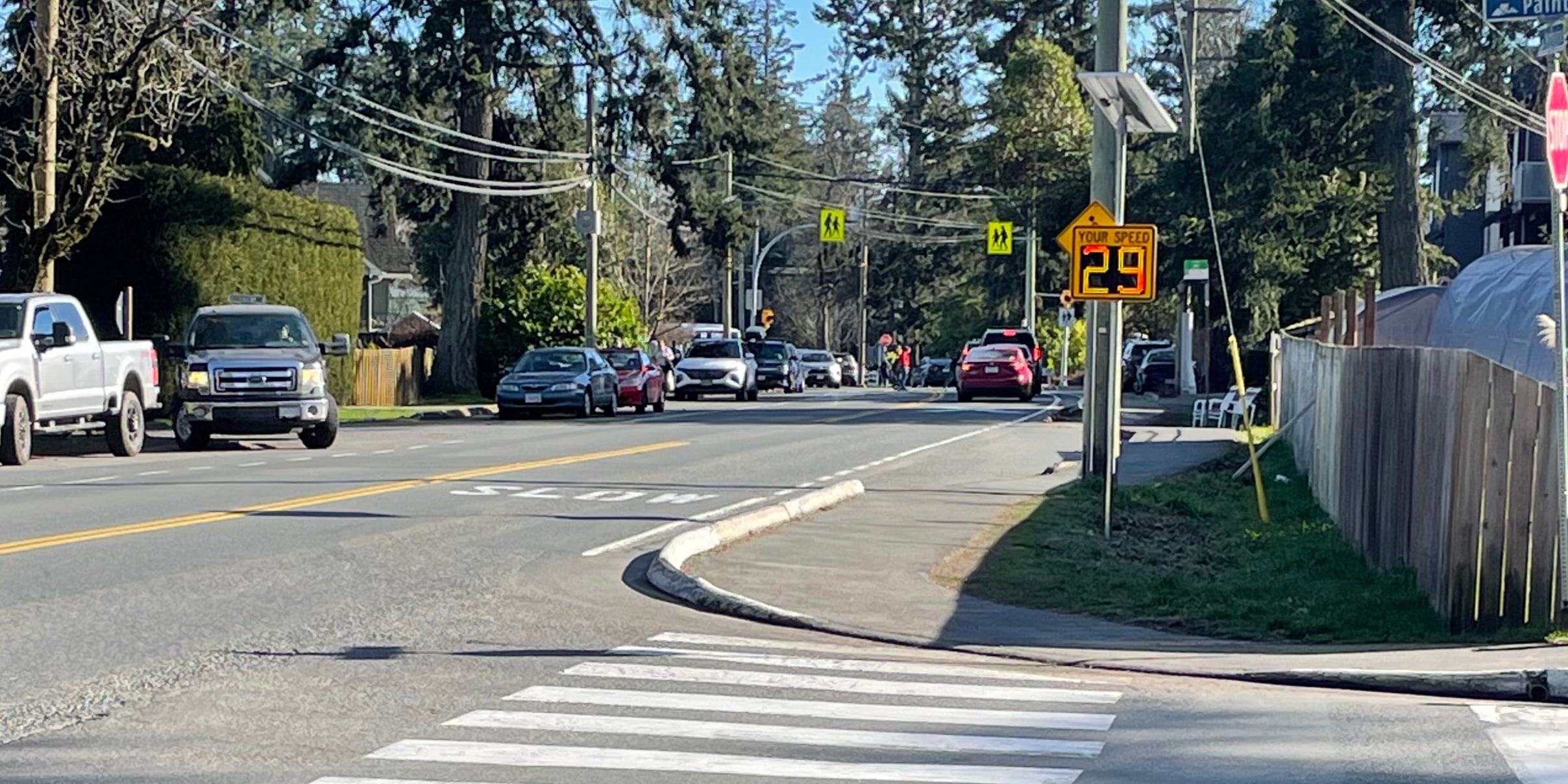Solar-powered Carmanah speed feedback sign displaying 29 beside a school crossing in Colwood