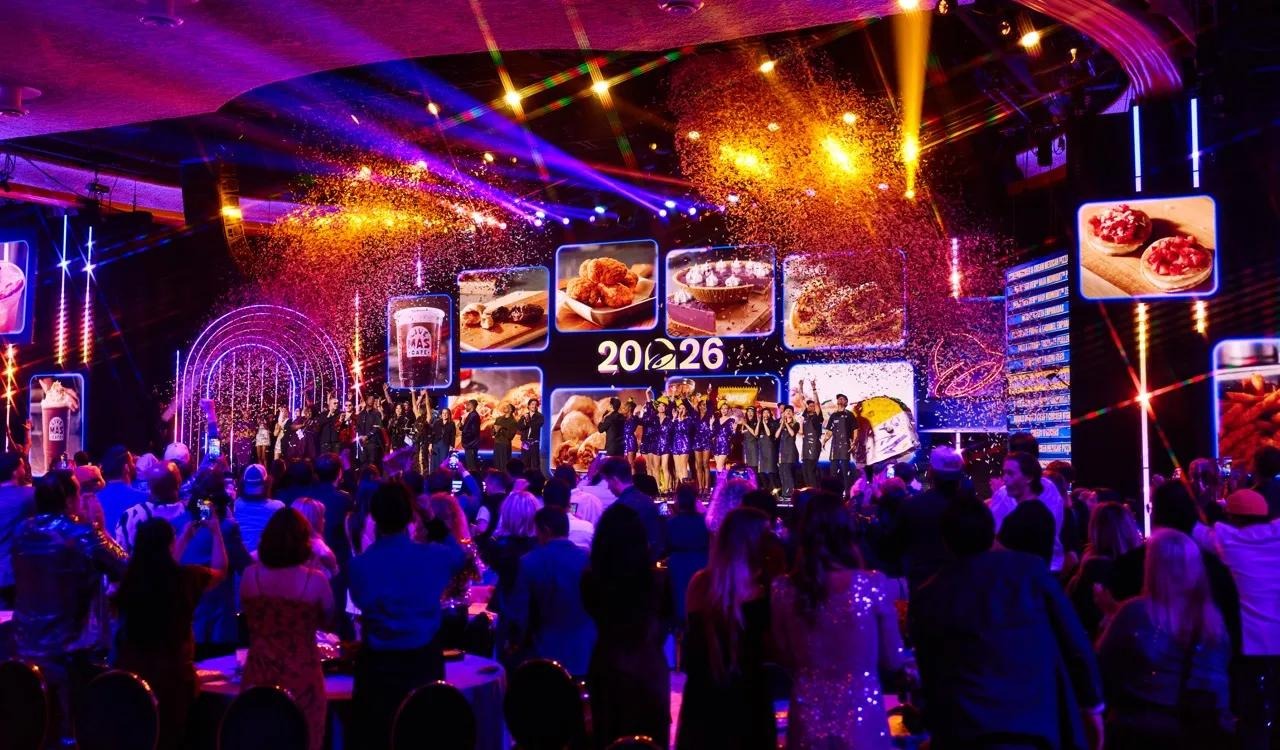 A crowd watches the confetti-filled stage at Taco Bell’s 2026 Live Más LIVE menu event