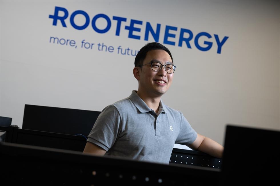 Taehwan Yoon seated in Root Energy's Seoul office beneath the company wordmark