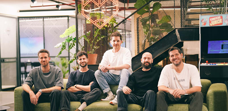 Tailor Brands leaders seated together in the company's Tel Aviv office