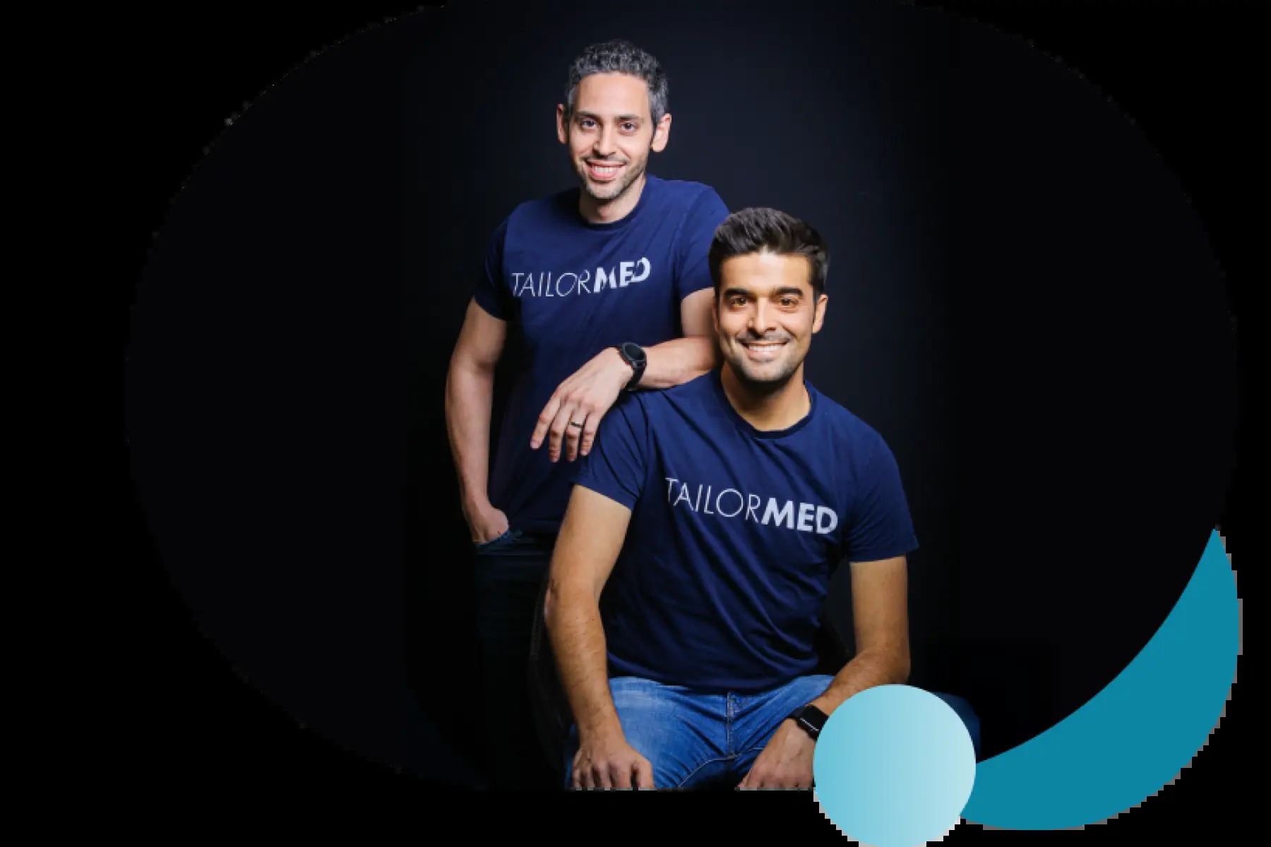 TailorMed co-founders Srulik Dvorsky and Noa Inbar wearing company shirts
