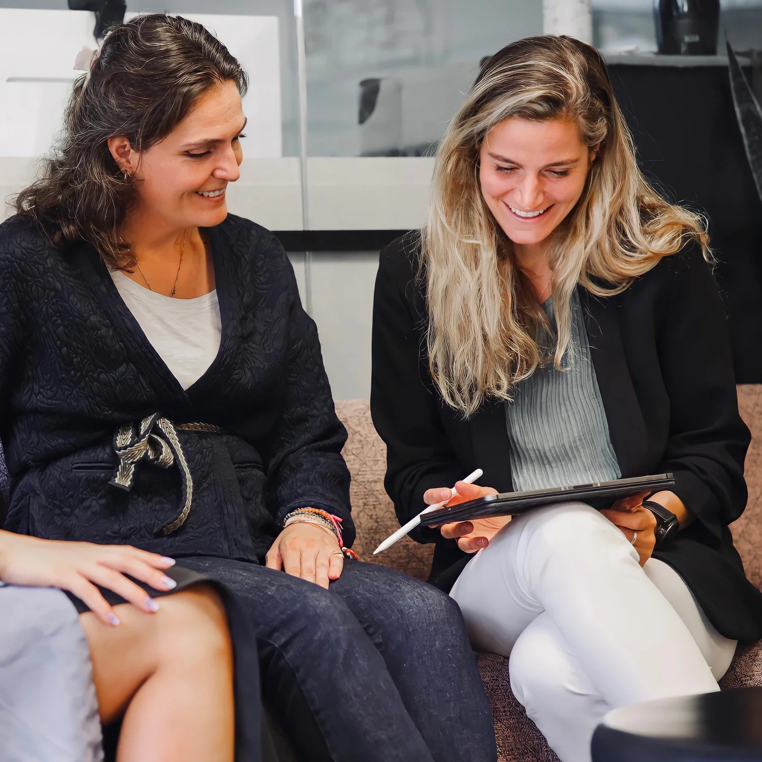 Karine Sarkissian and Sophie Durey working together with a tablet