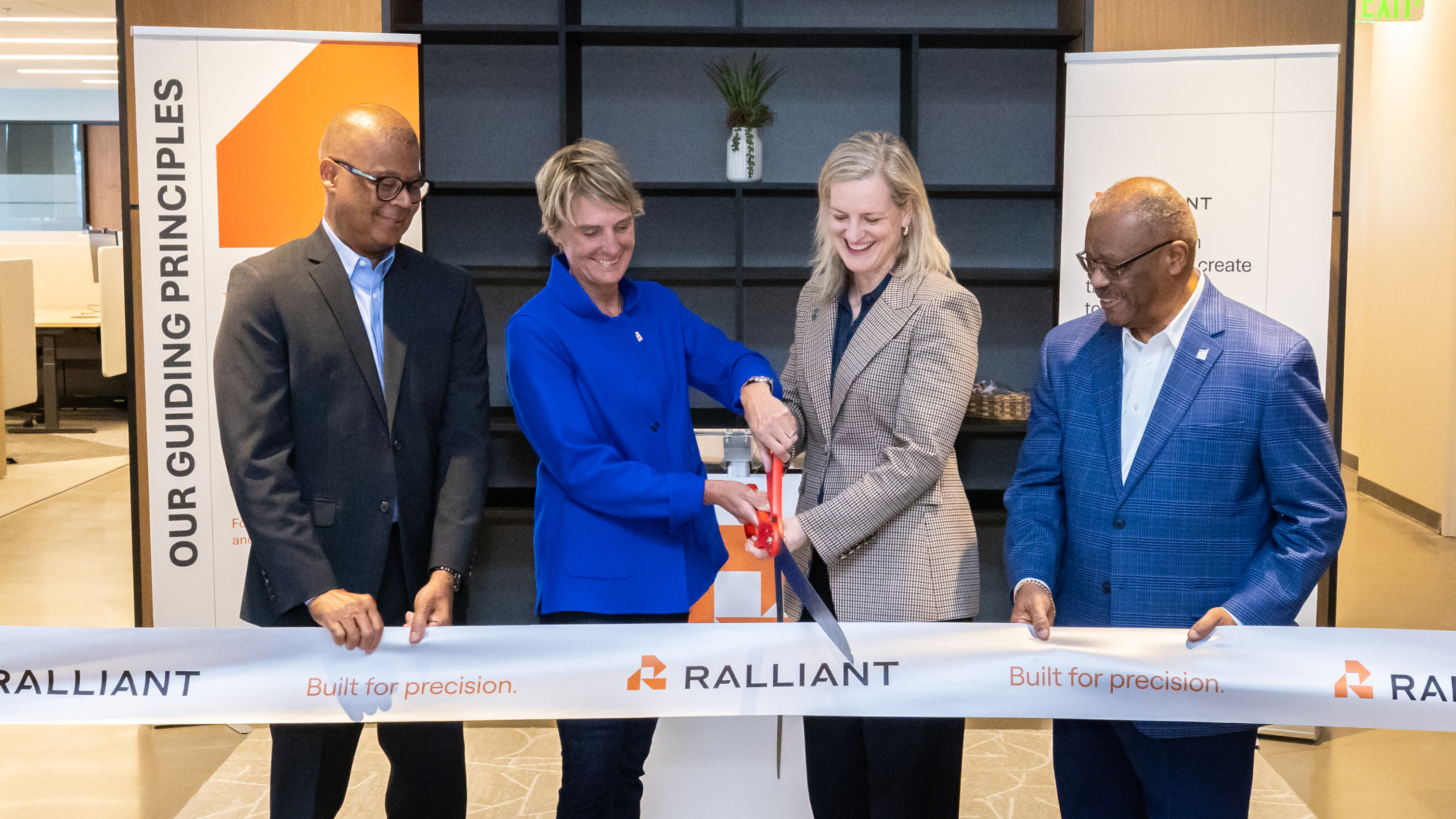 Tami Newcombe and Raleigh Mayor Janet Cowell cut the ribbon at Ralliant’s headquarters, joined by Kenny Flowers and Donald K. Mial