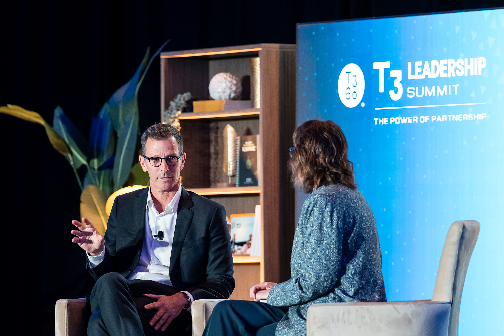 Tamir Poleg speaking with Stephanie Reid-Simons onstage at the 2026 T3 Leadership Summit