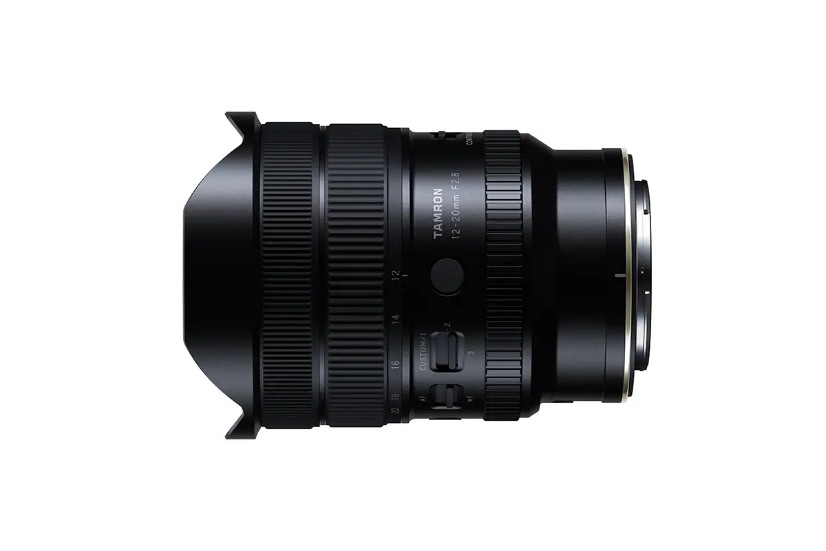 Tamron 12-20mm F2.8 ultra-wide zoom lens shown from the side on a white background