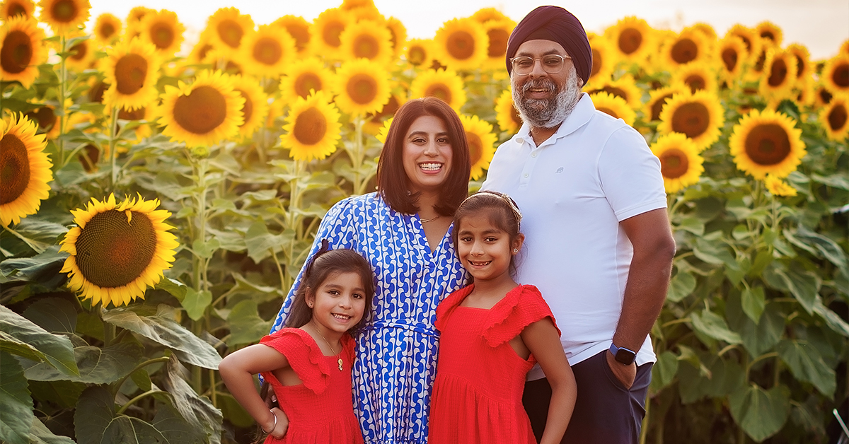 Tanbir Grover with his family in a sunflower field