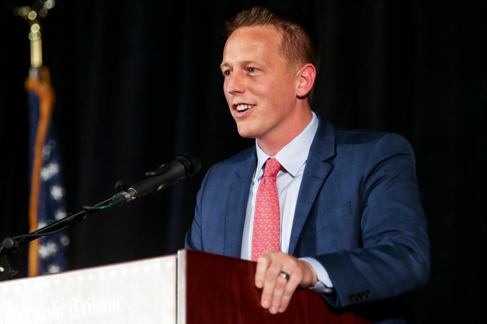 Tanner Ainge speaking behind a lectern at the 2017 Republican congressional debate in Provo