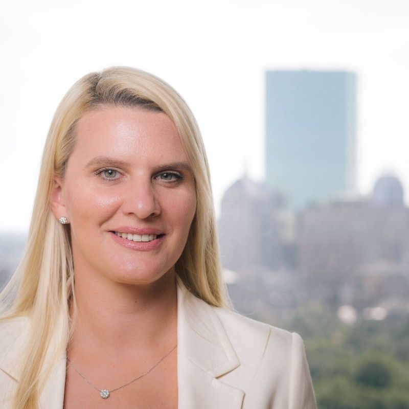 Tanya Bakalov, CEO and founder of HelloTeam, photographed against the Boston skyline