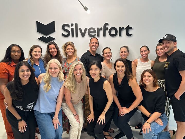 Silverfort colleagues gathering beneath the company sign at its new United States headquarters