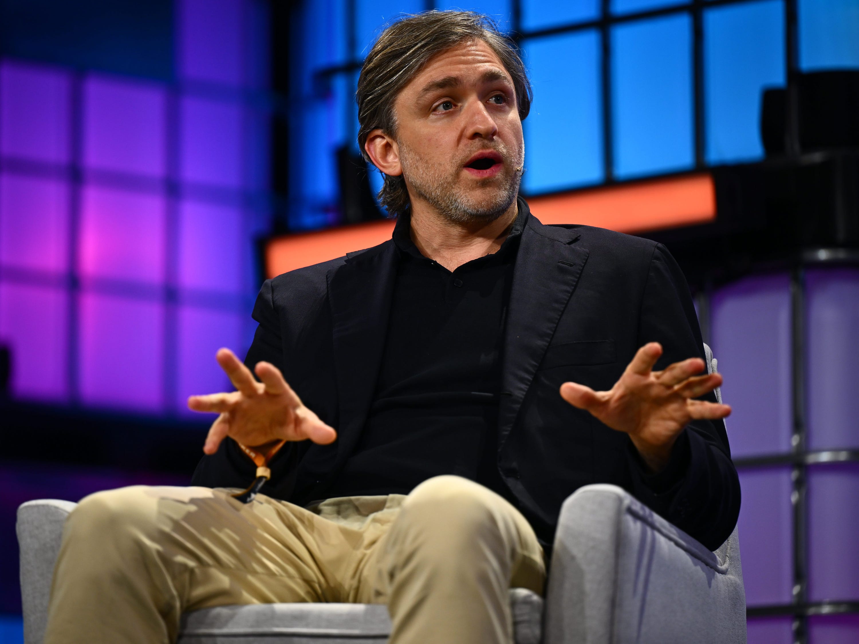 Taso Du Val speaking from an armchair on the Web Summit stage in Lisbon