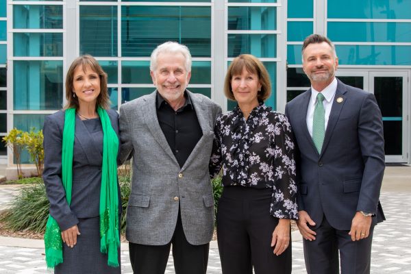 Andria Cunningham, John Kapelewski, Patti Lehrhoff and Stephen Joyner outside a Palm Beach State College building