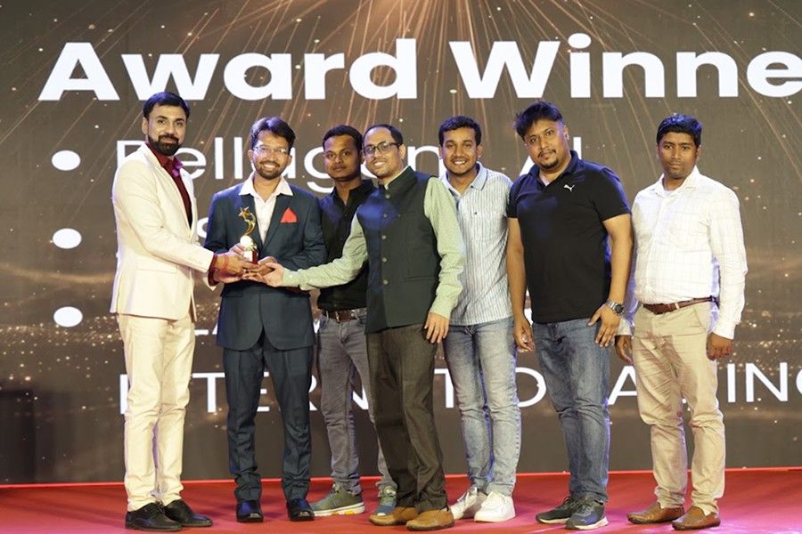 Techno Exponent employees receiving recognition on stage at the company’s 2026 anniversary celebration