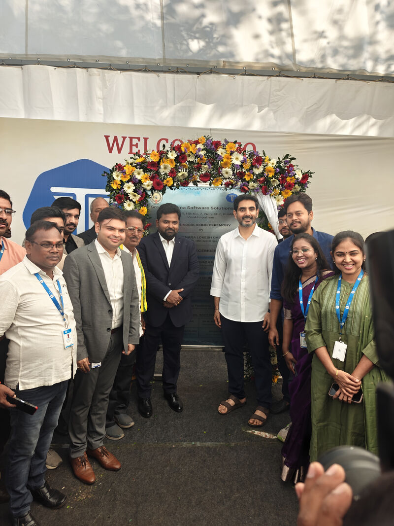 TechTammina representatives and guests gathered around a flower-decorated plaque at the Visakhapatnam campus groundbreaking.