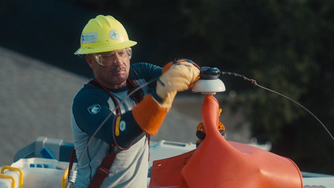 Tampa Electric lineworker updating equipment on the electric system