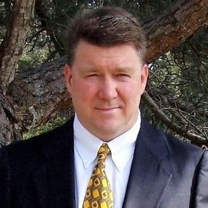 Portrait of Denver Dale, founder of Tecton Capital and Pale Blue Capital