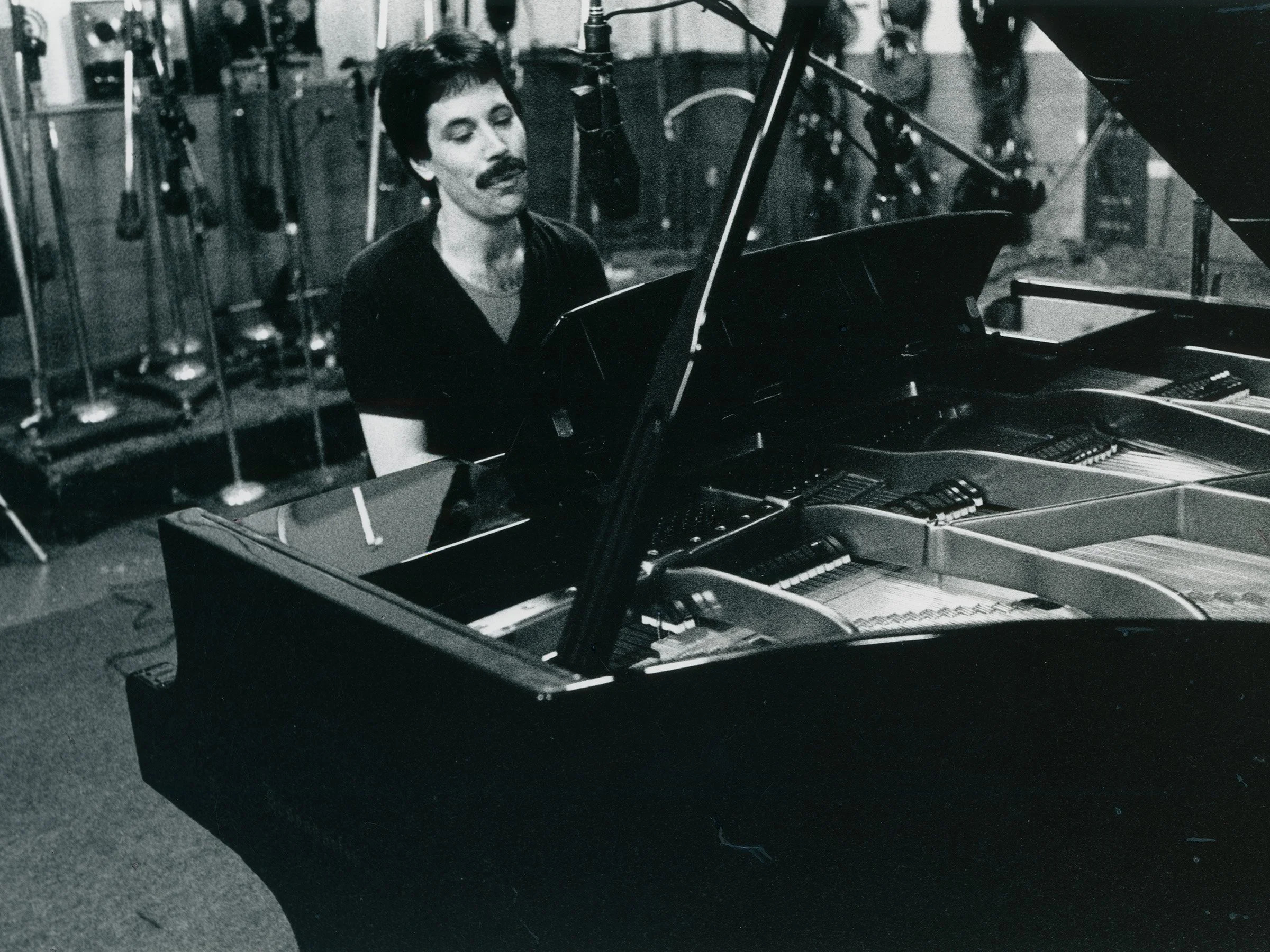 Ted Gioia seated at a piano during the Tango Cool recording session in San Francisco in 1990
