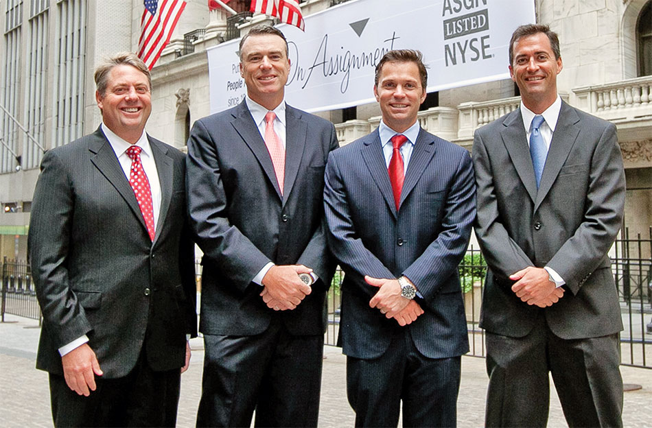 Ted Hanson, Brian Callaghan, Win Sheridan and Jeffrey Veatch standing outside the New York Stock Exchange