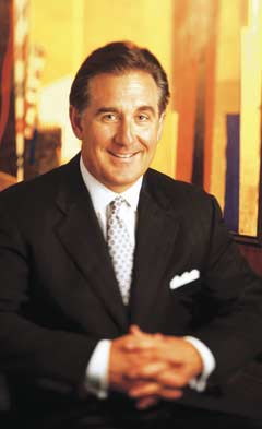 Ted Miller seated in a suit in Crown Castle’s 2000 annual report