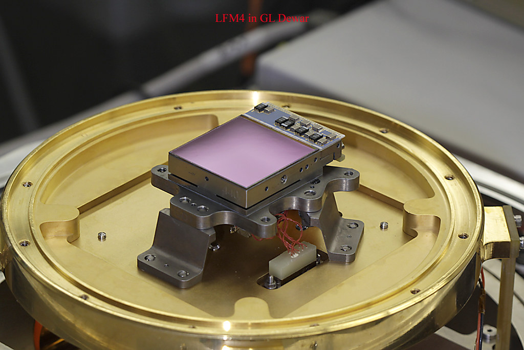 A Webb NIRCam detector mounted in a gold-colored test assembly