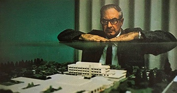 Tenet predecessor vice president Dallas Riddle beside a scale model of the Modesto medical complex in 1969