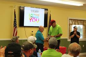 A JSI community gathering with a charitable presentation