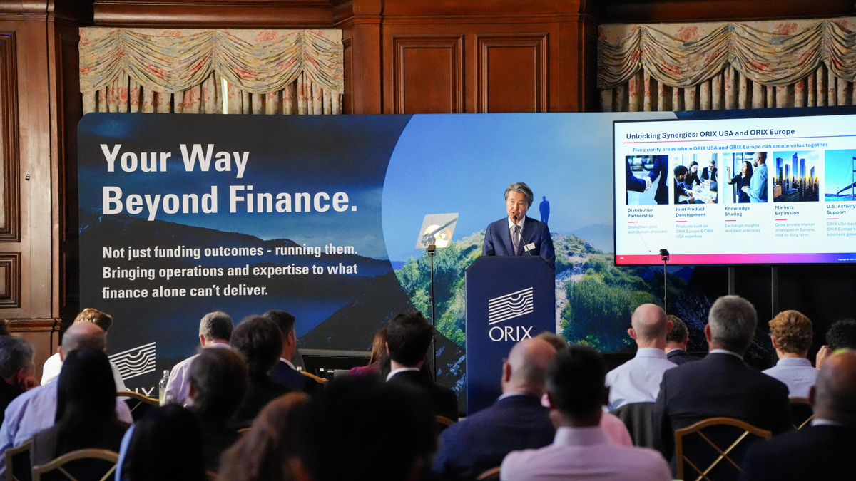 Terry Suzuki speaking at a lectern during ORIX Investor Day in London