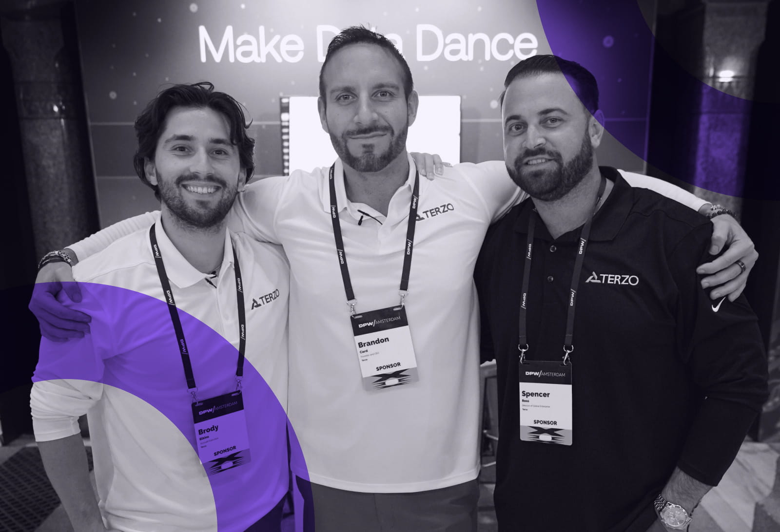 Three Terzo team members at an industry event, with Brandon Card in the center