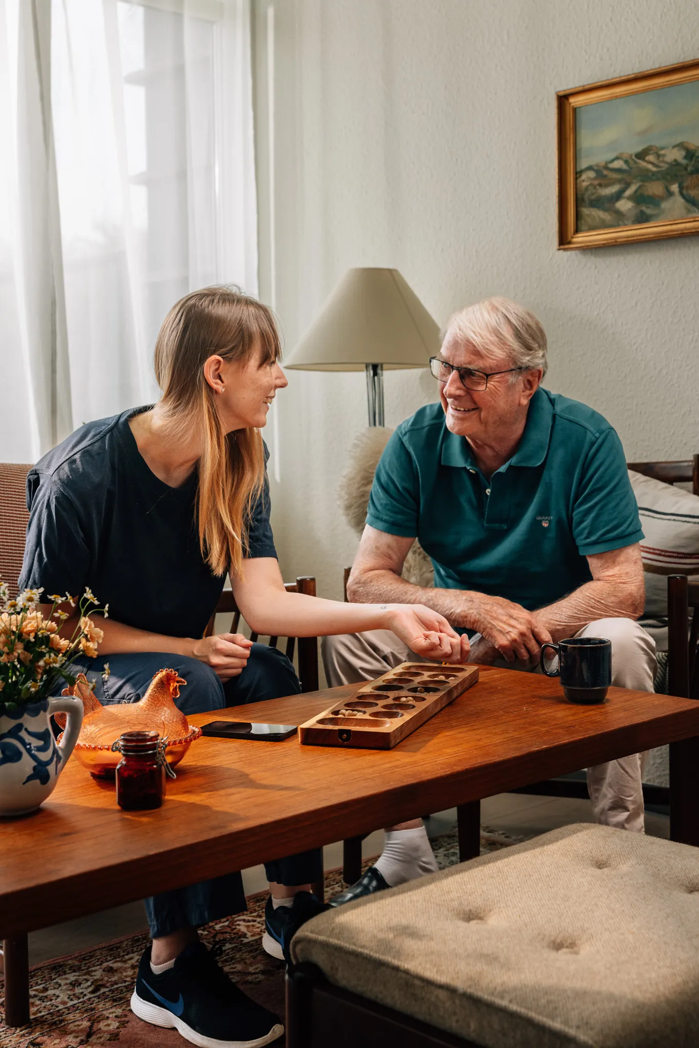 A caregiver assisting an elderly resident in long-term care