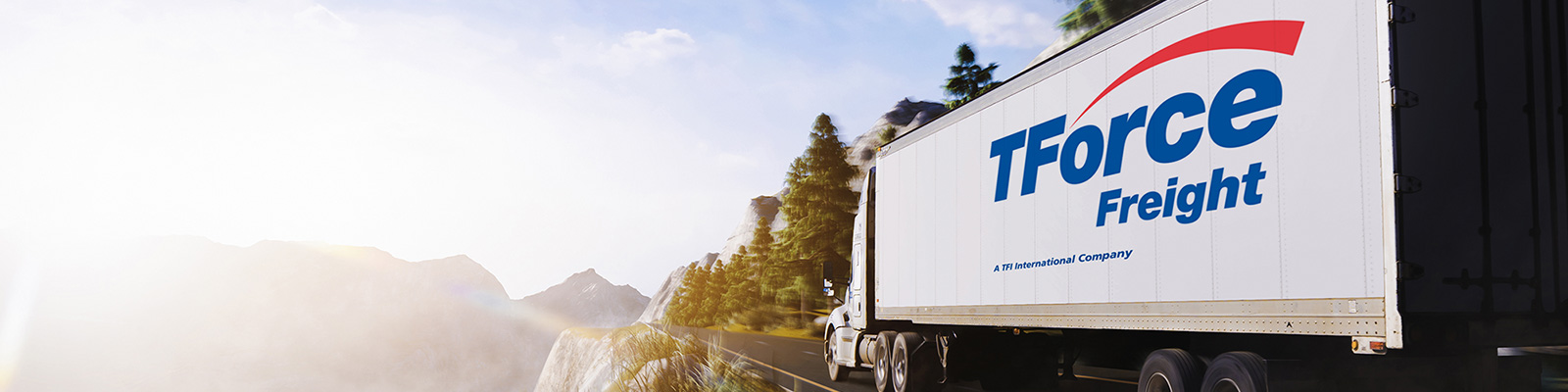 TForce Freight trailer on a mountainous road in a company promotional photograph