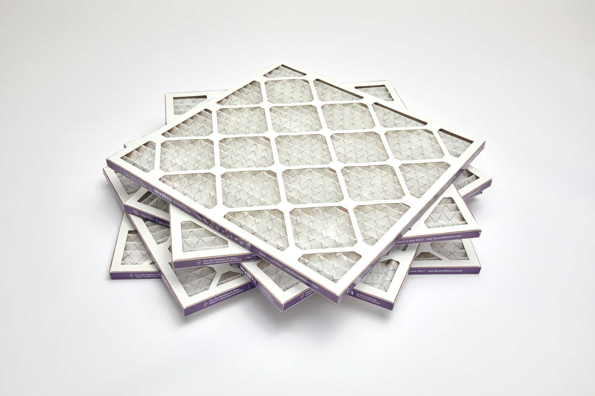 Stacks of boxed home air filters in a warehouse