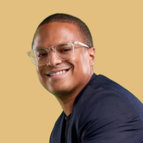 Djoann Fal, founder of Atlas, wearing clear-framed glasses