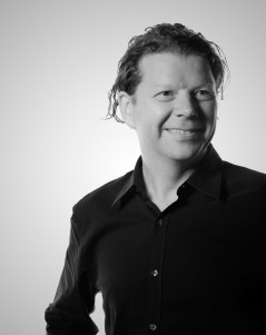 Black-and-white portrait of Matt Cowley, listed as The Bank CEO in its archived team page