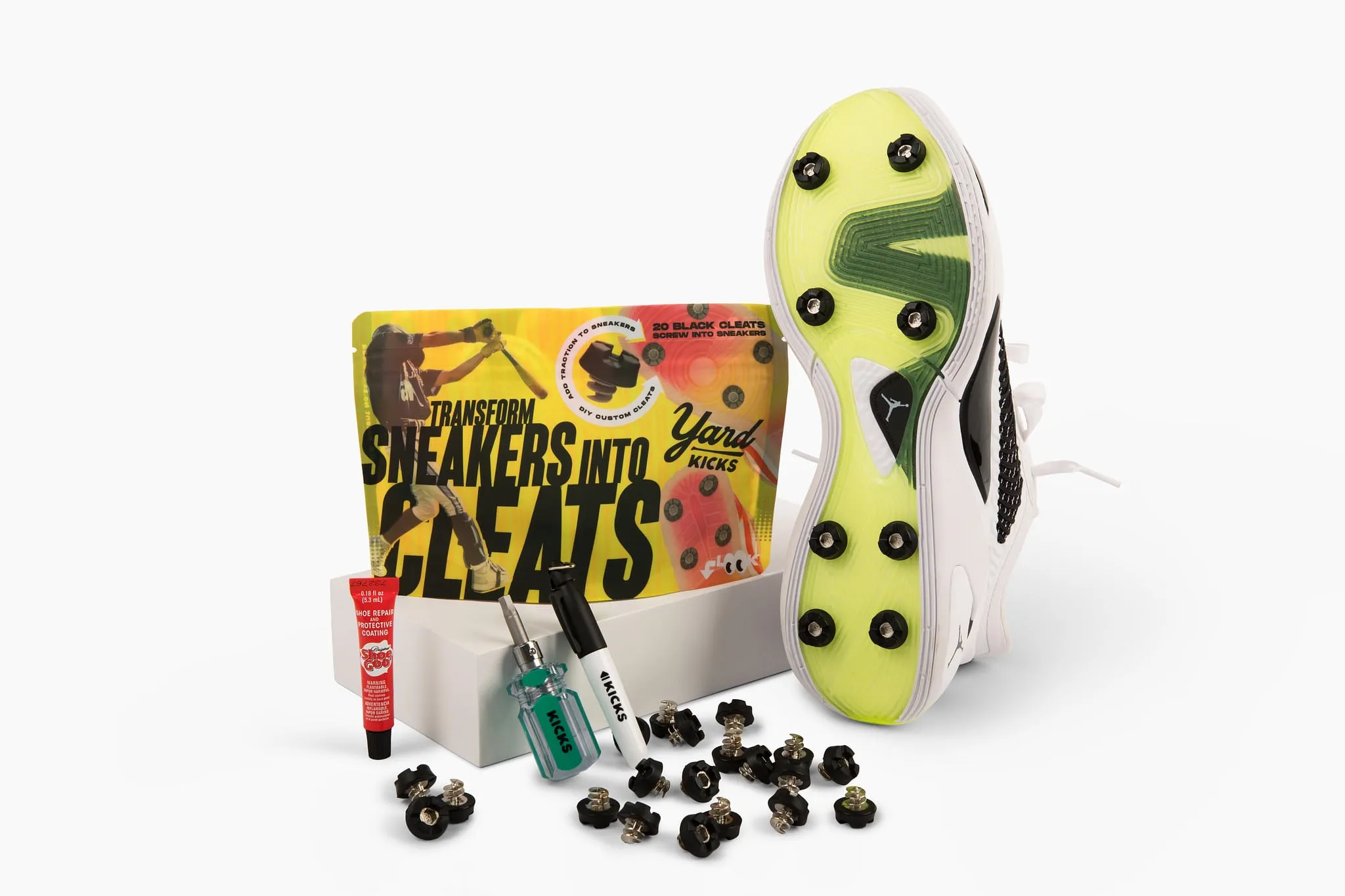 Golfkicks traction kit and a sneaker fitted with cleats