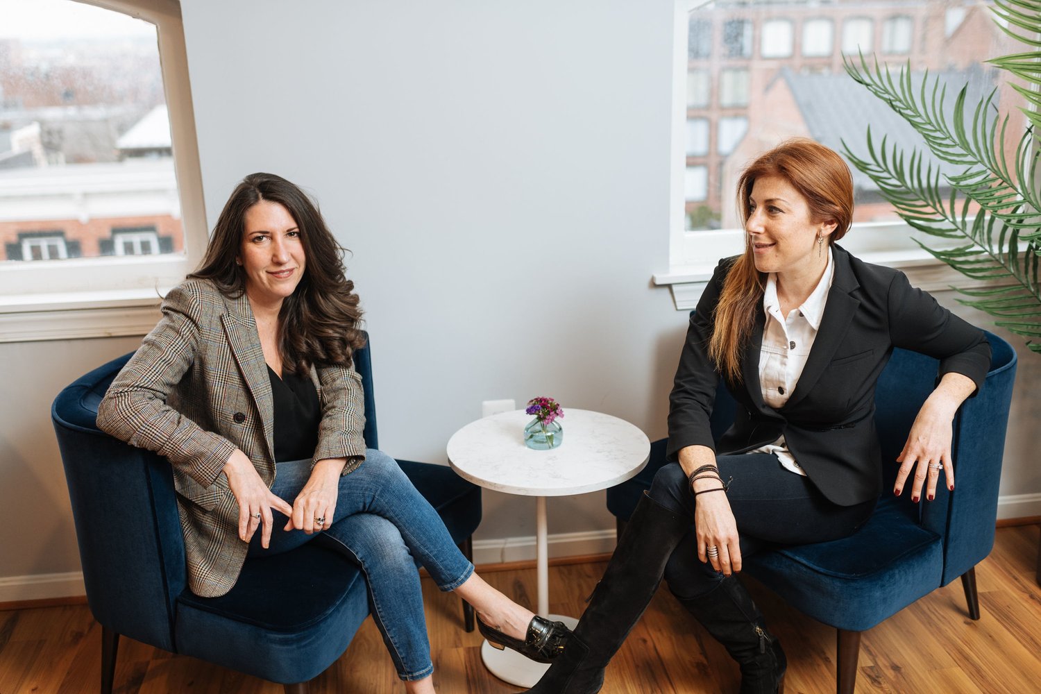 The Brand Guild co-founders Barbara Martin and Jayne Sandman seated in their Washington office