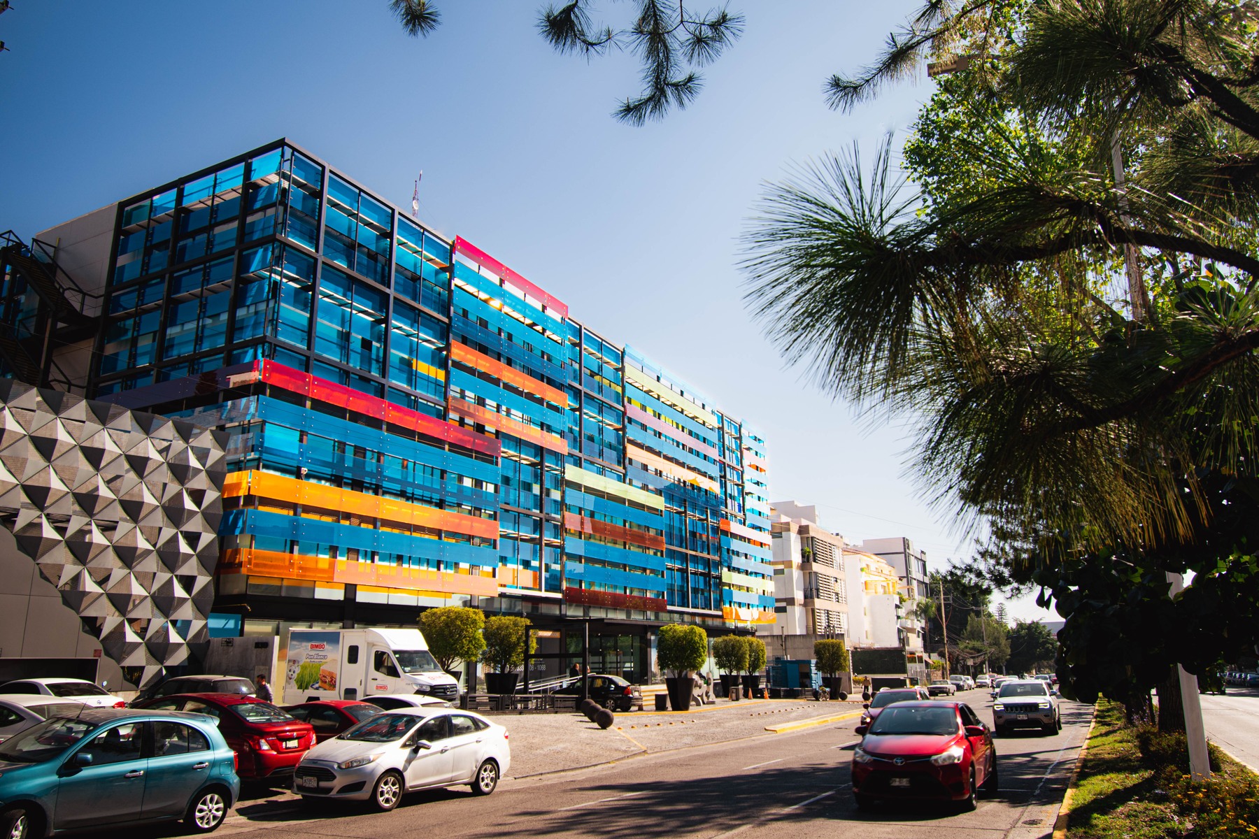 Colorful glass office building shown on The Call Gurus website