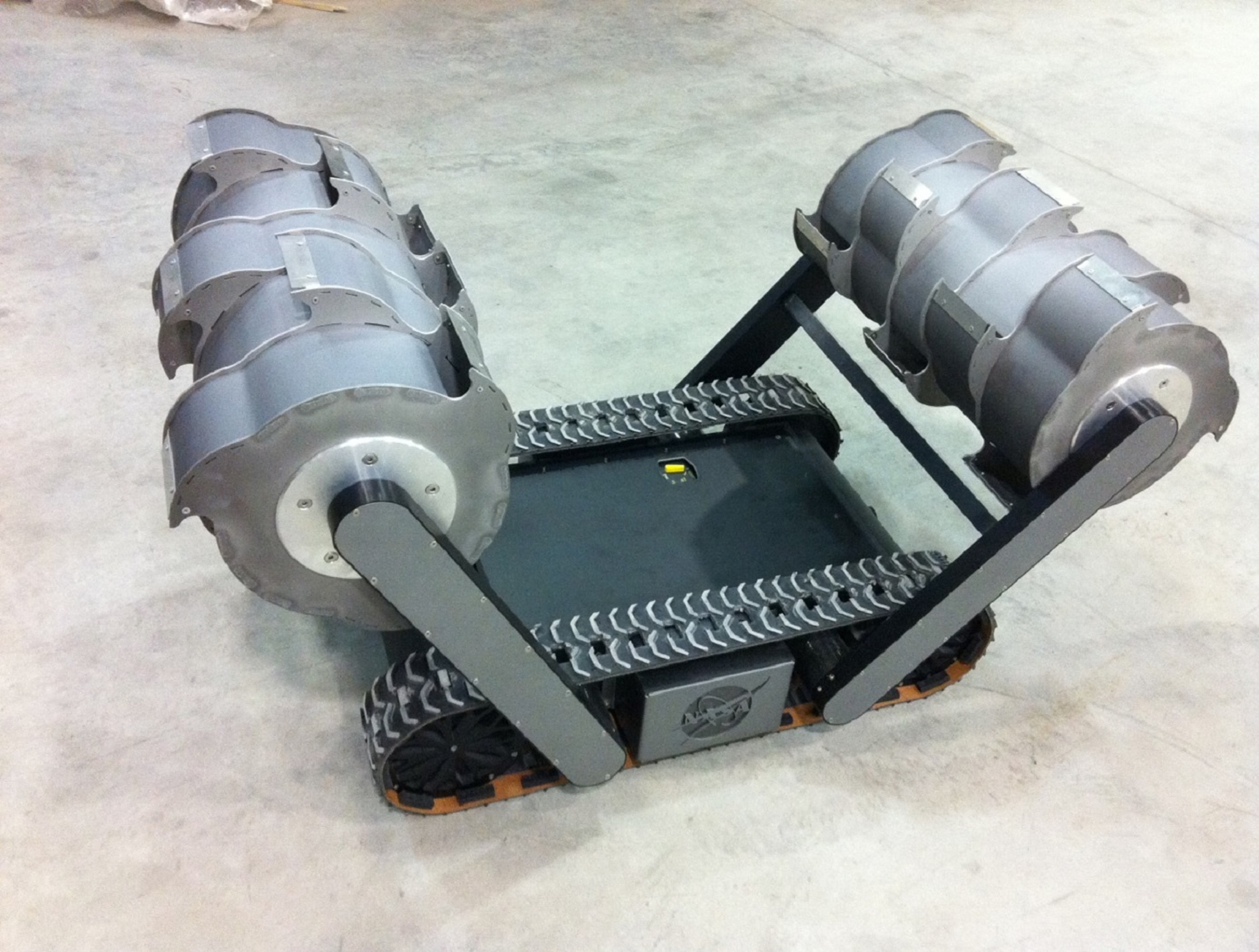 NASA RASSOR excavator on a sandy test surface