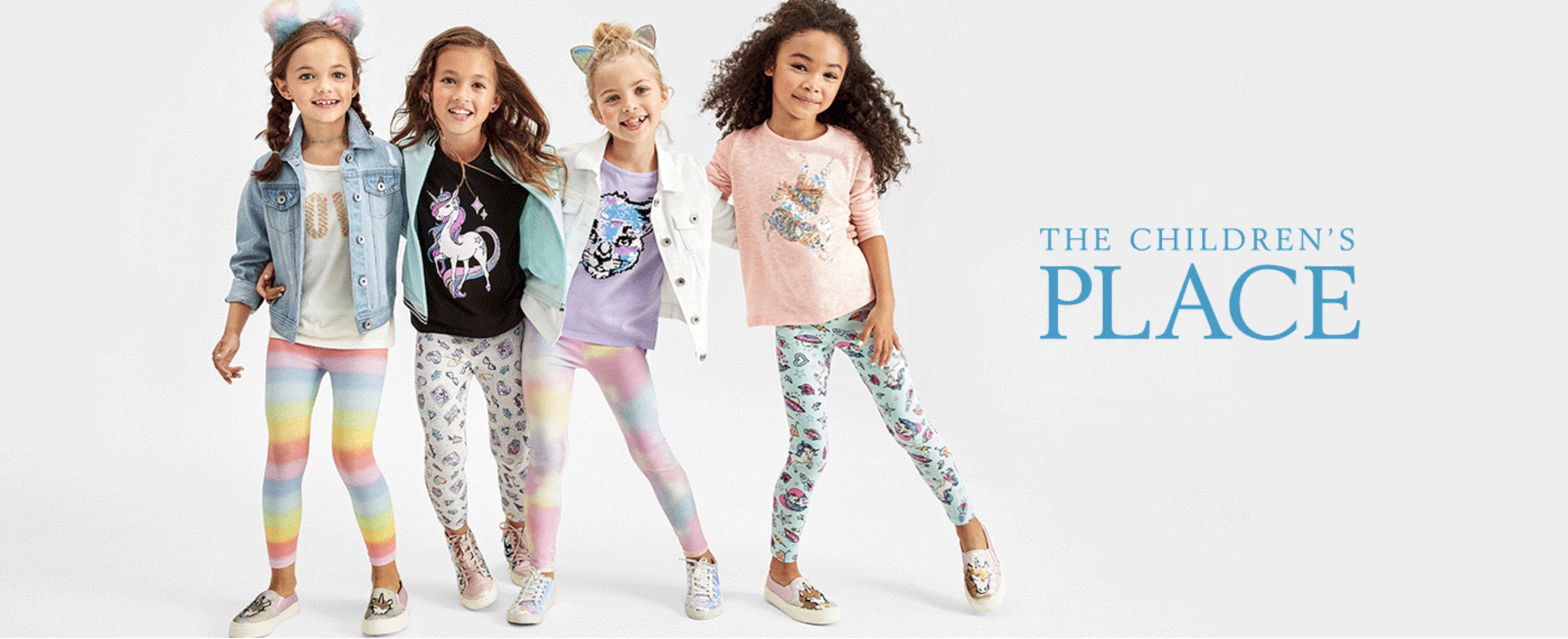 Children modeling graphic tops, denim jackets and colorful leggings from The Children’s Place