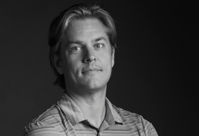 Black-and-white portrait of Cognitive Revolution host Nathan Labenz