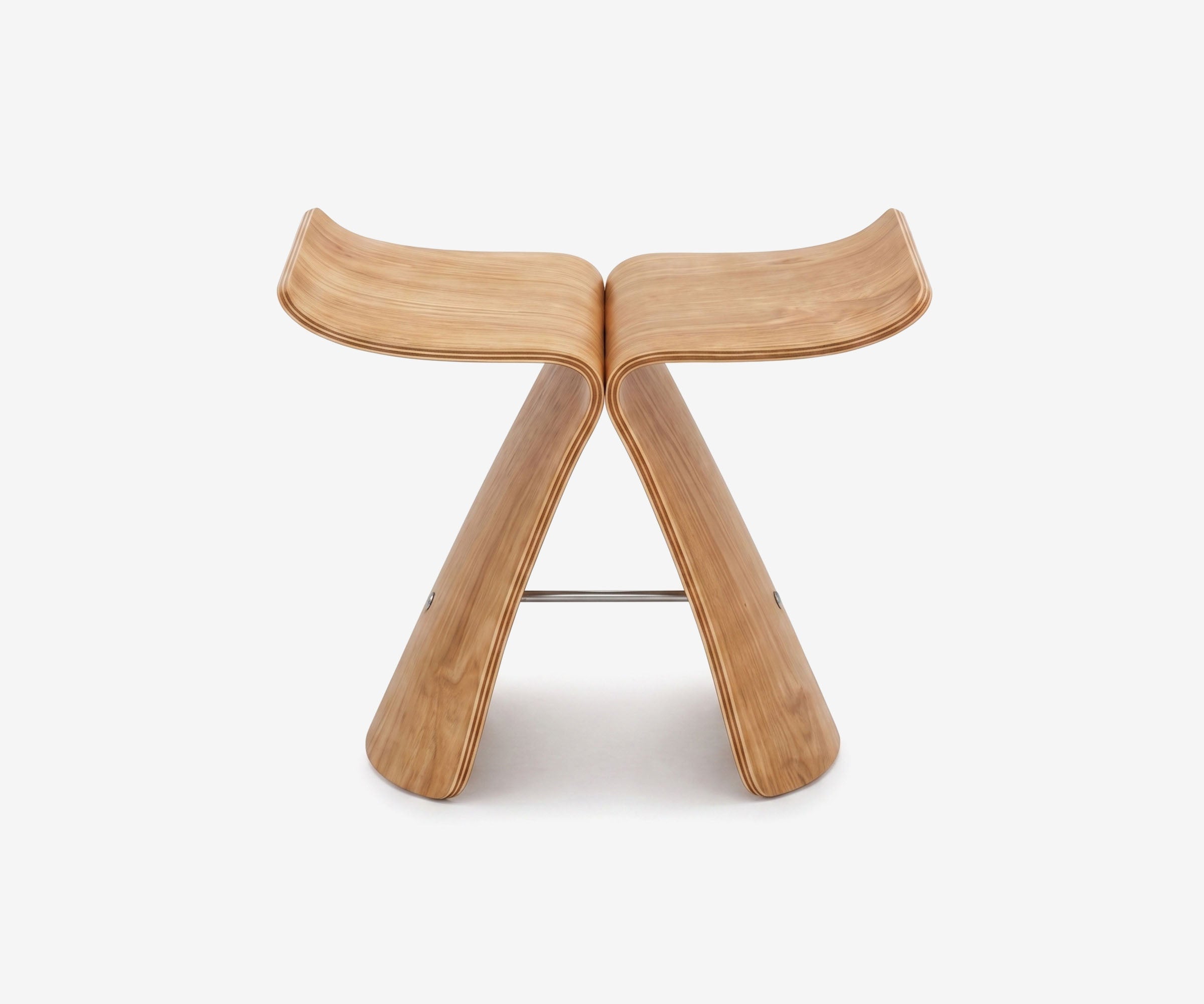The Essential's curved Haiku Stool in wood