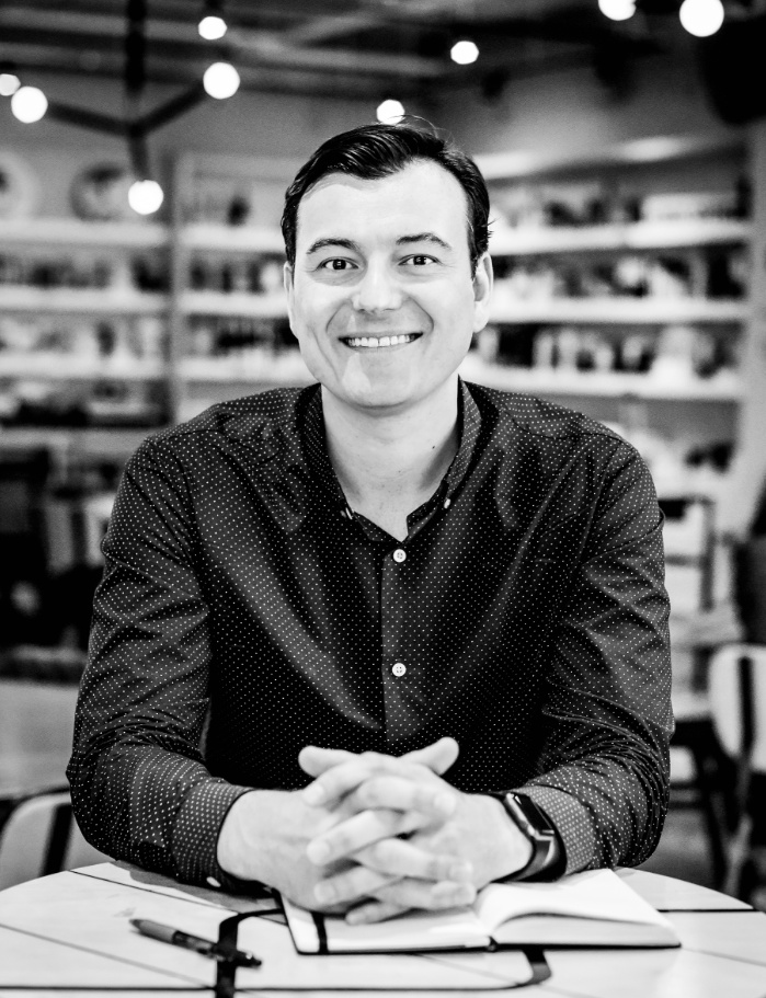 The Full Ratchet founder and host Nick Moran seated at a table