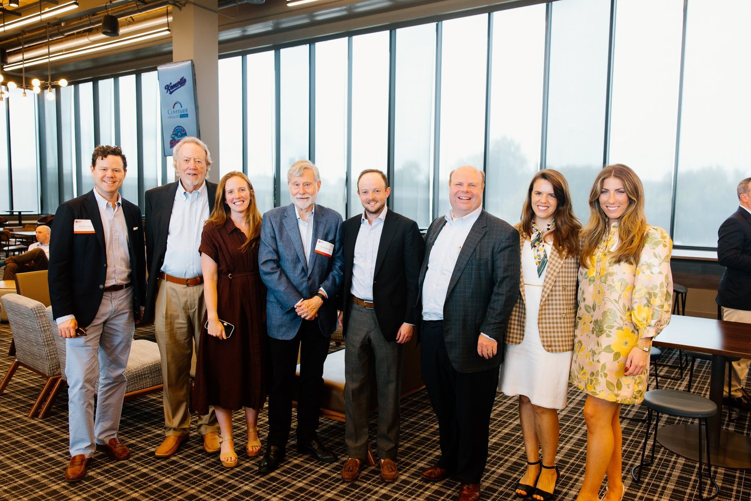 Members and guests of The Ingram Group posing at an indoor event
