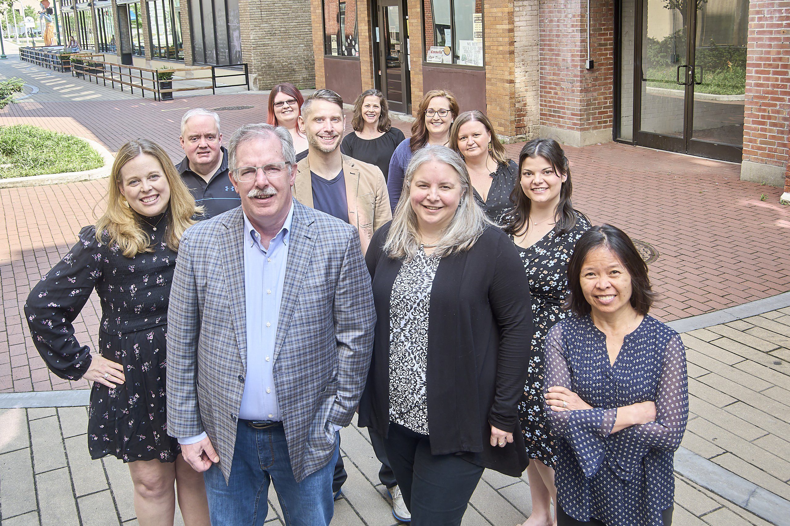 The Manahan Group team standing together on Capitol Street in Charleston