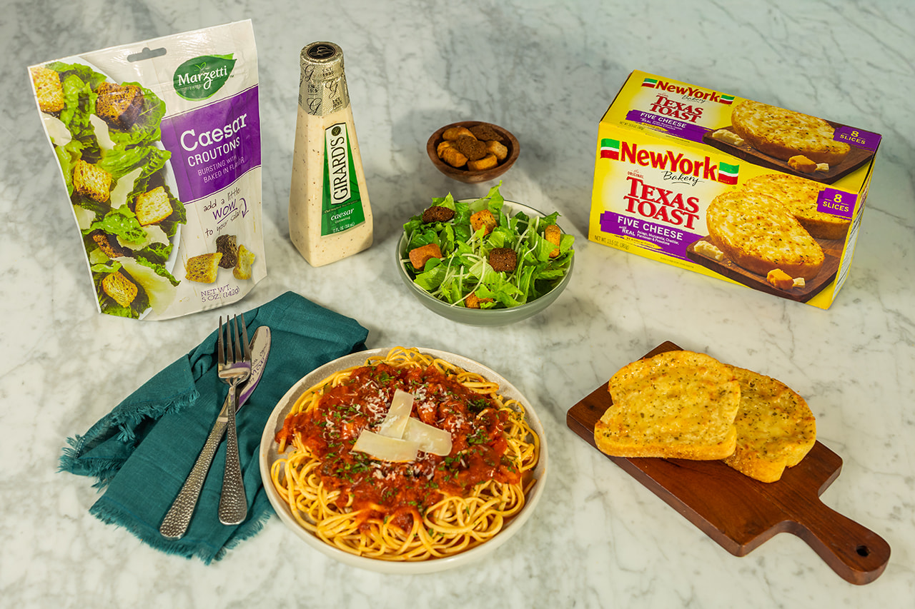 Marzetti croutons, Girard’s Caesar dressing and New York Bakery Texas toast beside a pasta dinner