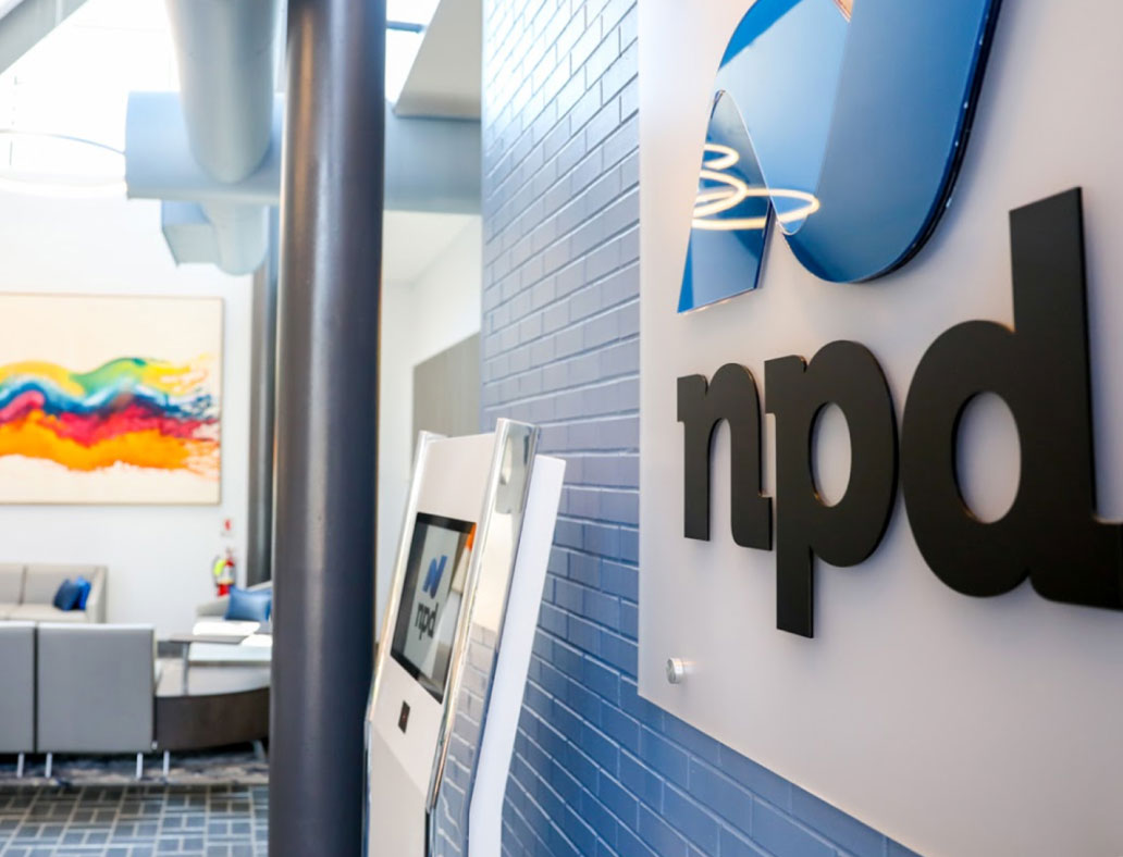 NPD lettering on the wall of an office reception area