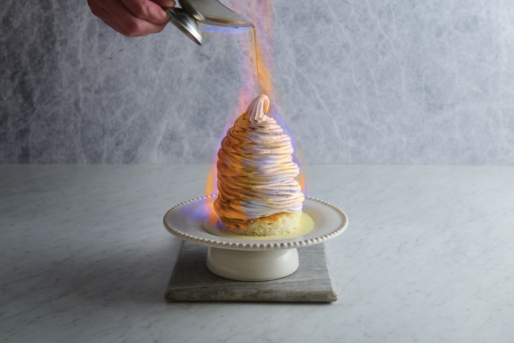 Oceanaire’s Baked Alaska dessert in an official promotional photograph