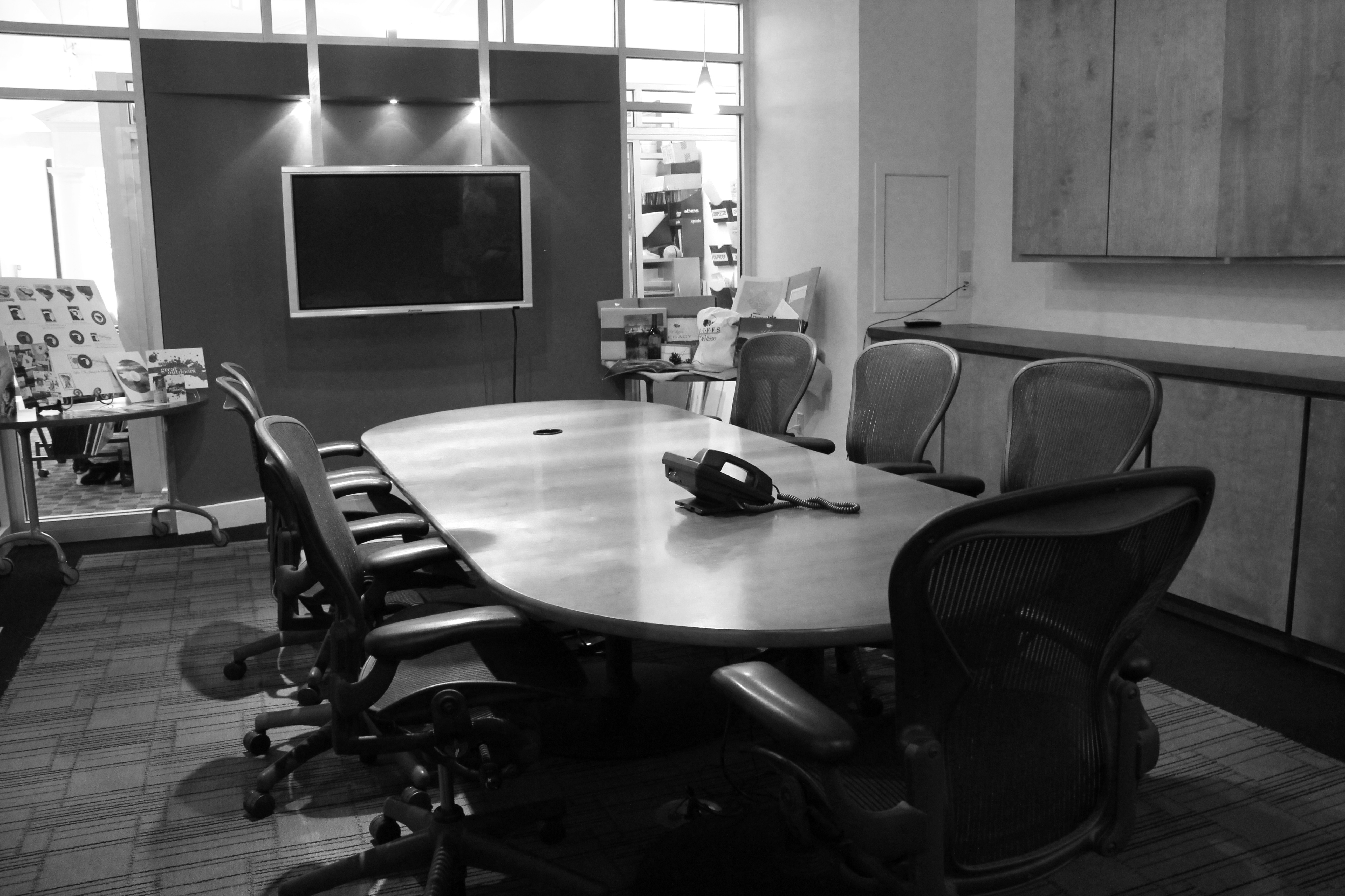 The Palladian Group boardroom with a long conference table and presentation screen