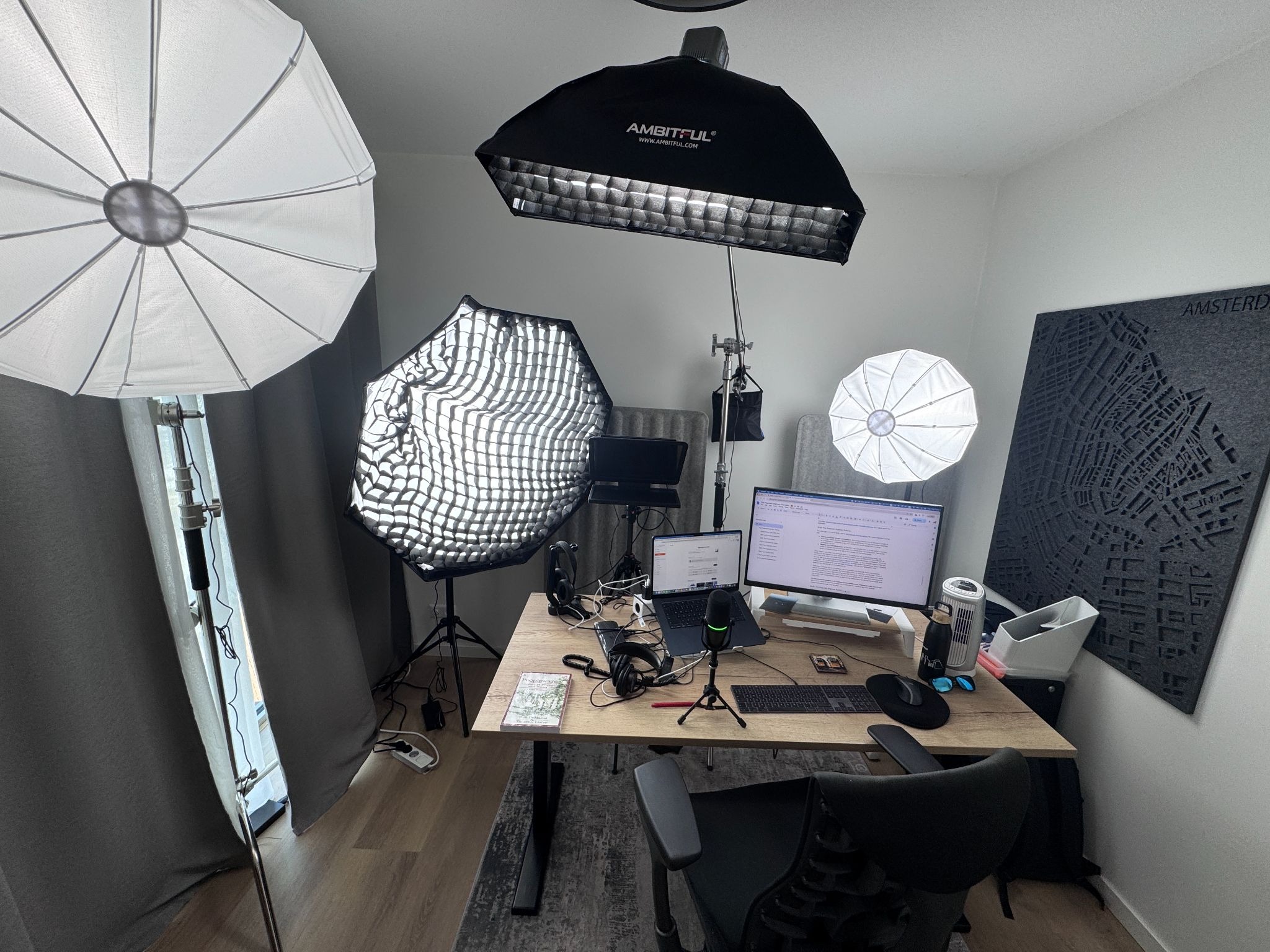 The Amsterdam podcast studio with lighting, microphones and computer monitors